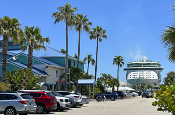 The Cove at Port Canaveral with a cruise ship in the background