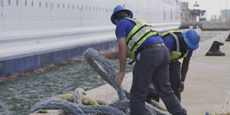 Linehandlers at Port Canaveral untying a cruise ship