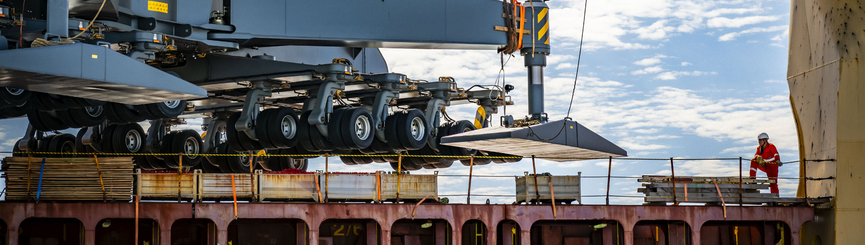 Mobile harbor crane being offloaded